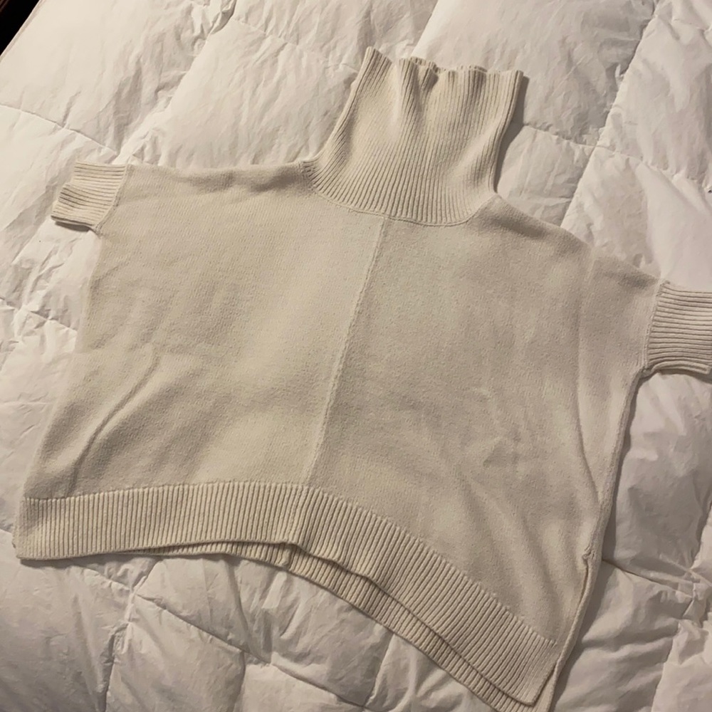 Cream colored women’s short sleeved cowl neck
